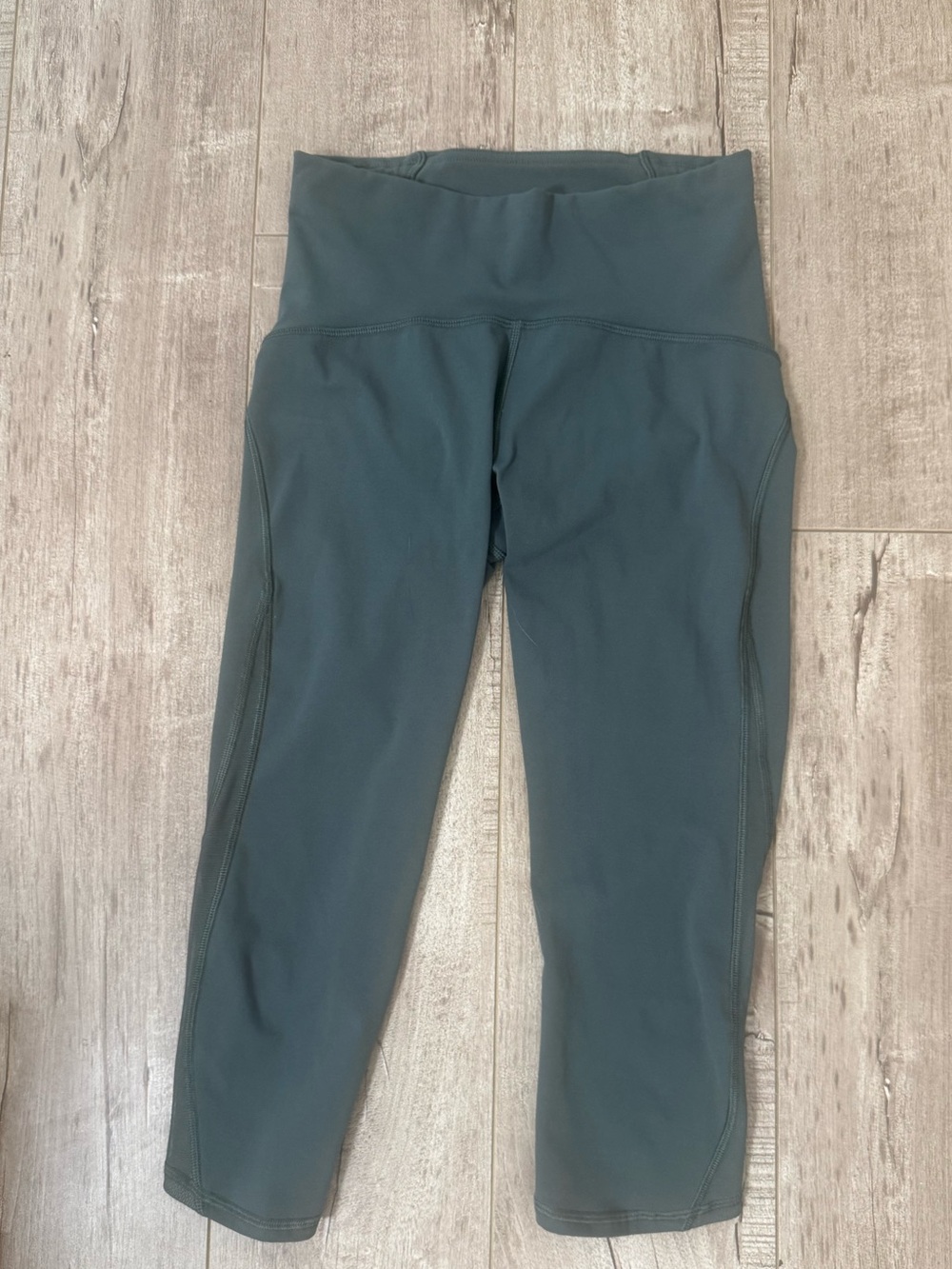 Lululemon cropped green leggings with mesh panels